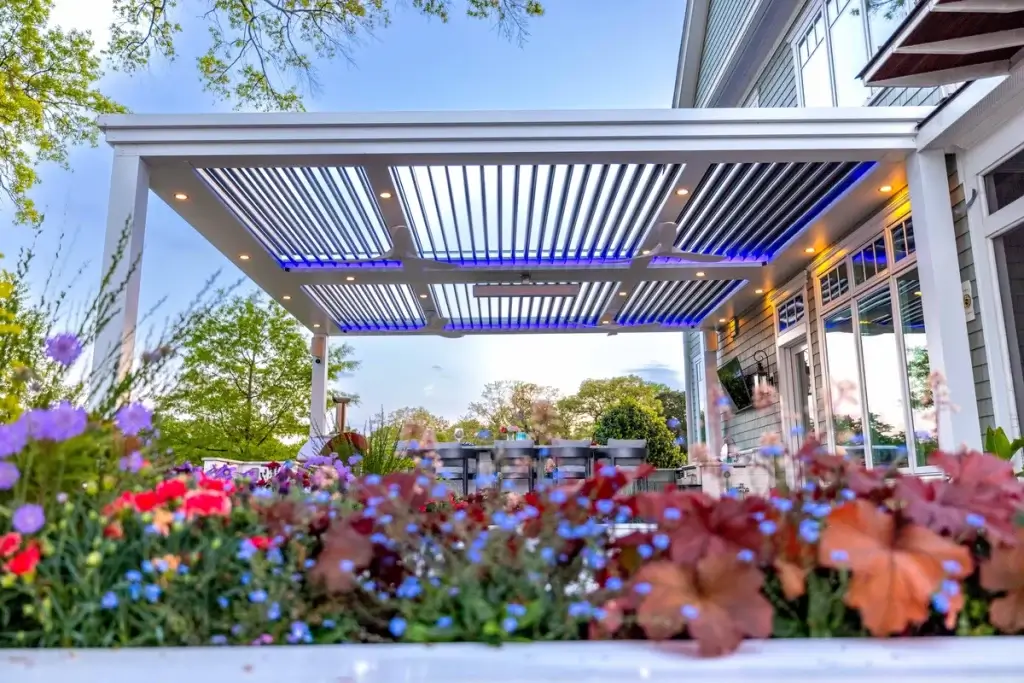 StruXure Pergola X with overhead and trax lights and speakers